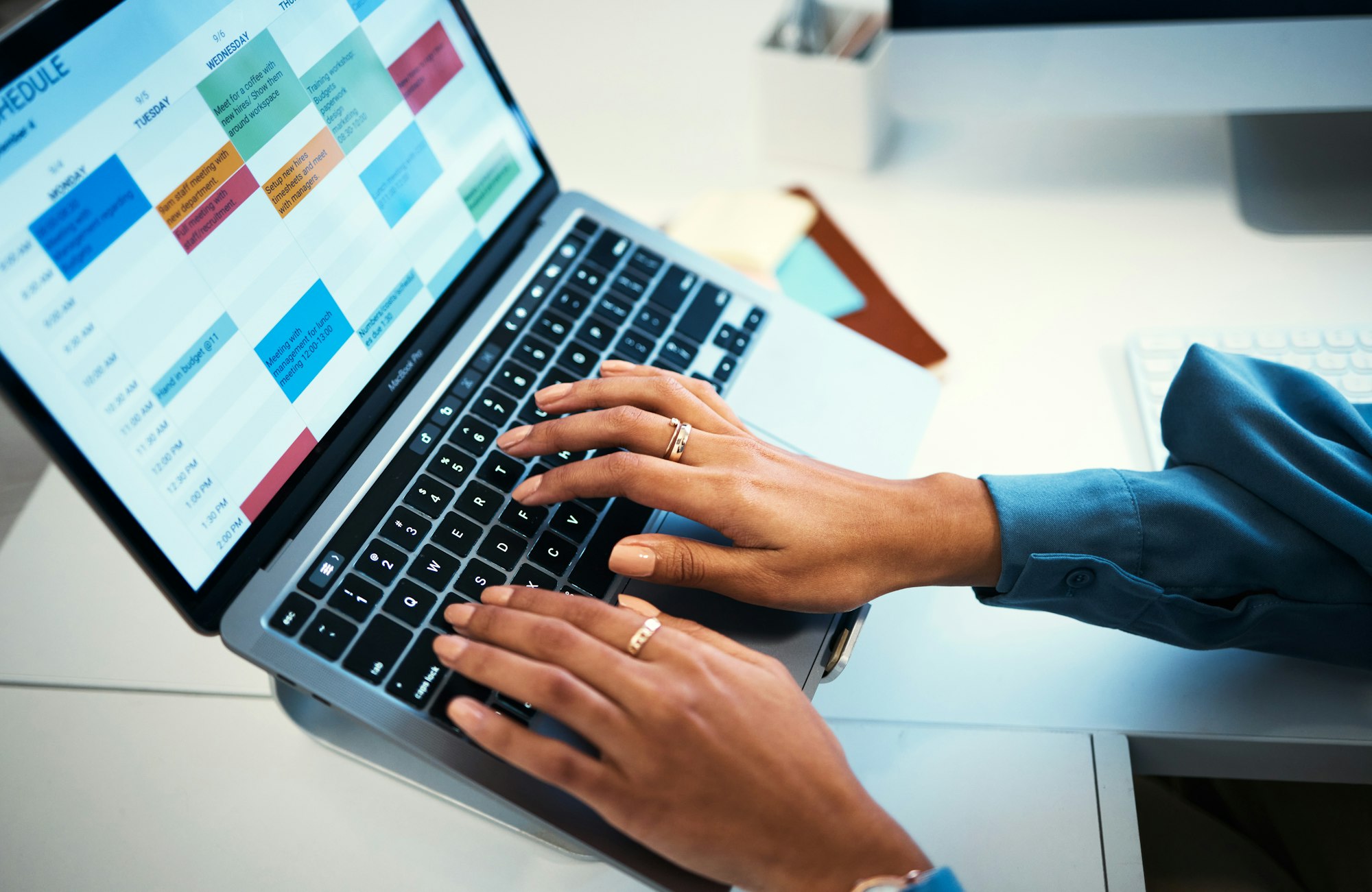 Hands of woman on laptop, typing spreadsheet or schedule, agenda and reminder in office administrat